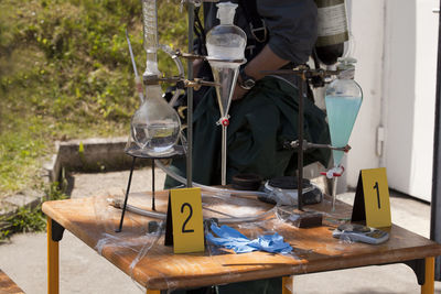 Low section of man standing on table