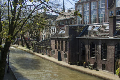 Canal amidst buildings in city