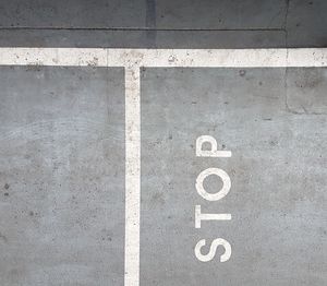 High angle view of arrow sign on road