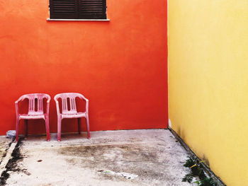 Empty chair outside building