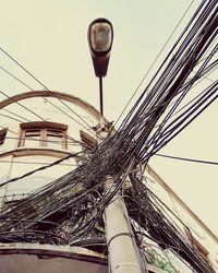 Low angle view of cables against clear sky