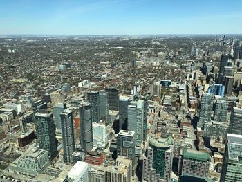 High angle view of modern buildings in city against sky