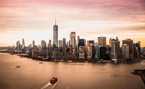 View of buildings in city at sunset