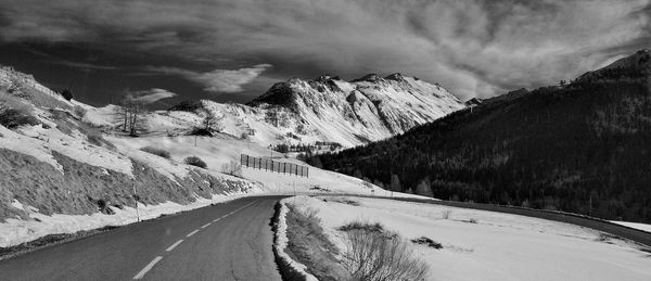 Scenic view of mountains against sky during winter