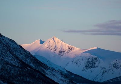 Scenic view of snowcapped mountains against sky