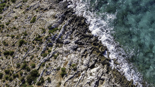 High angle view of rocks in sea