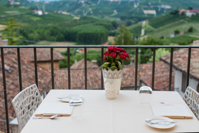 Red flower vase on table