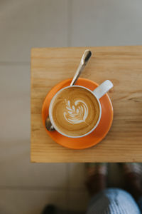 Directly above shot of coffee cup on table