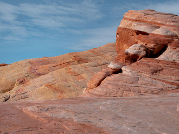 Rock formations on landscape against sky