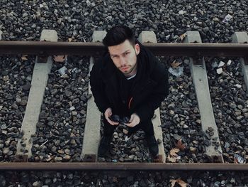 High angle view of man on railroad track