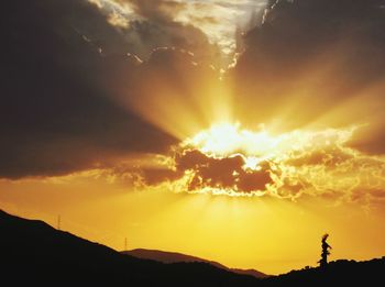 Scenic view of dramatic sky during sunset