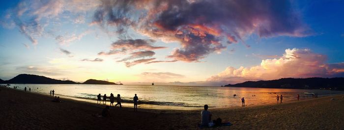 Panoramic view of beach against sky during sunset