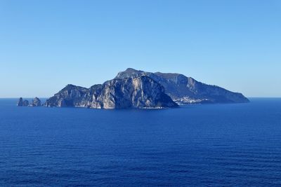 Scenic view of sea against clear blue sky