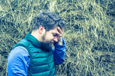 Portrait of man in grass