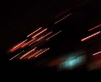 Light trails against sky at night