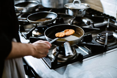 Man preparing food in kitchen at home