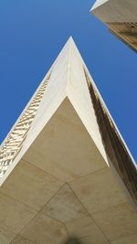 Low angle view of building against blue sky