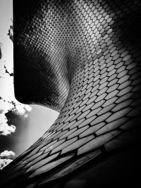 Low angle view of brick wall against sky