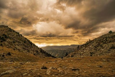 Scenic view of mountains against sky during sunset