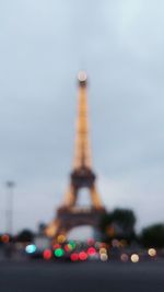 Low angle view of tower against cloudy sky