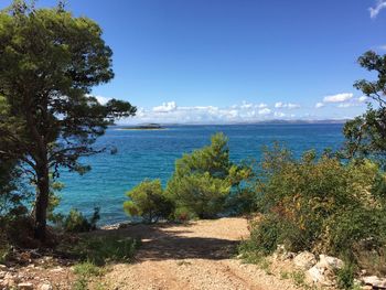 Scenic view of sea against blue sky