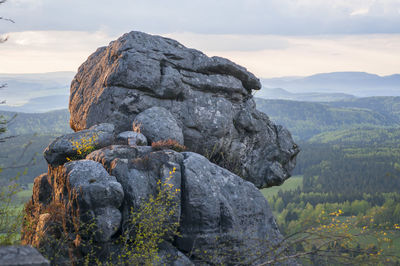 Rocks on mountain against sky