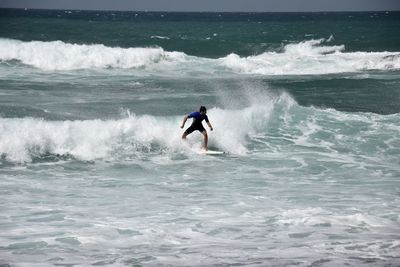 Man surfing in sea