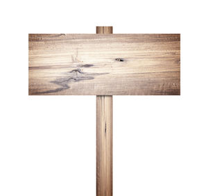 Close-up of wooden plank against white background