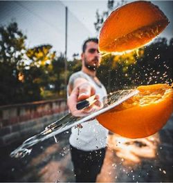 Man playing with ball in water