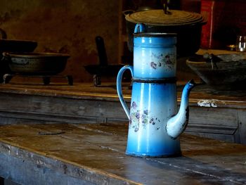 Close-up of old objects on table at home