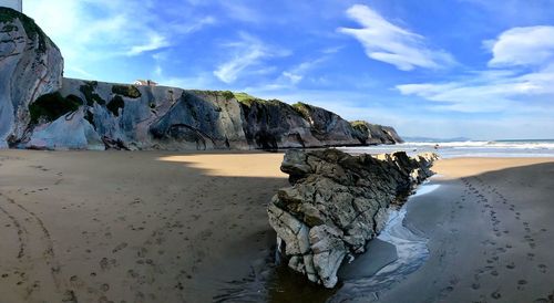 Scenic view of beach against sky