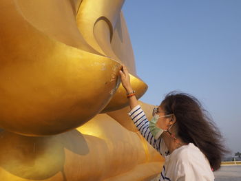 Midsection of woman holding balloons