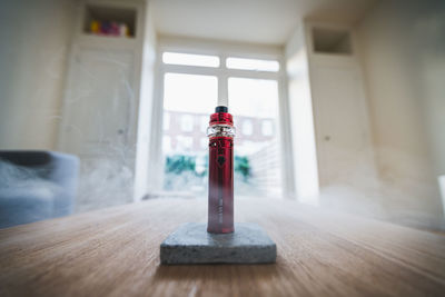 Close-up of open door on table in building