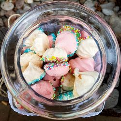 High angle view of candies in jar on table