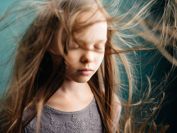 Close-up of girl with tousled hair