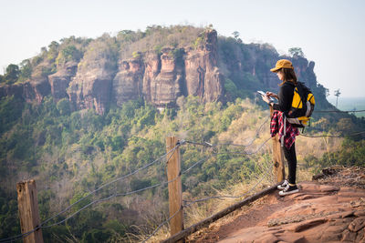 Full length of man standing on rock