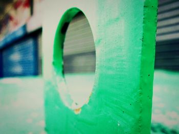 Close-up of green window on wall