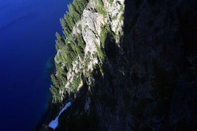 Scenic view of mountains against blue sky