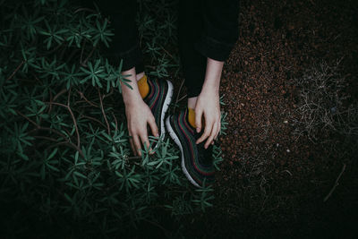 Low section of woman on field