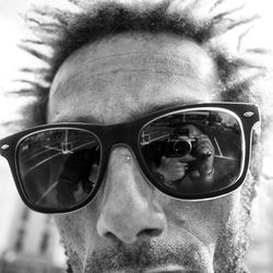 Close-up portrait of man wearing sunglasses