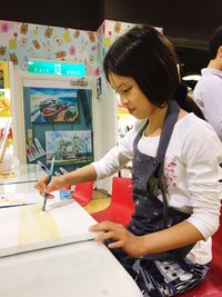 Woman working in traditional clothing