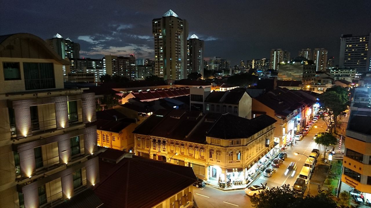 HIGH ANGLE VIEW OF ILLUMINATED CITYSCAPE AT NIGHT
