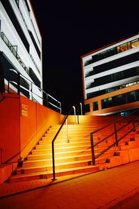 Low angle view of illuminated building at night