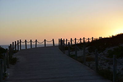 View of bridge against clear sky during sunset