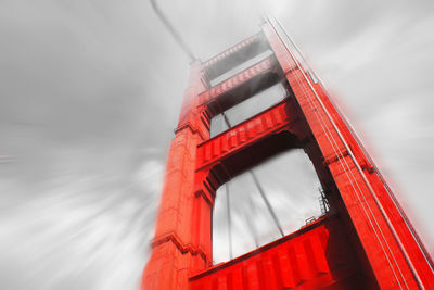 Low angle view of red bridge against sky