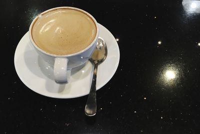 High angle view of coffee cup on table