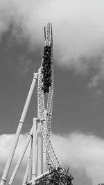 Low angle view of rollercoaster against sky