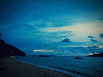 Scenic view of sea against cloudy sky