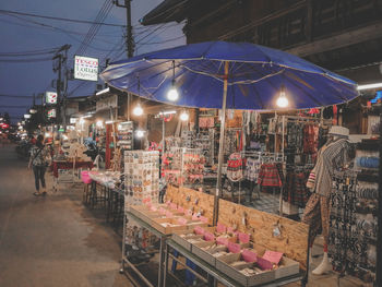 Illuminated street market at night