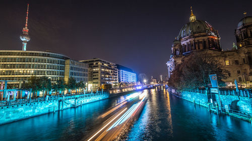 Illuminated buildings in city at night